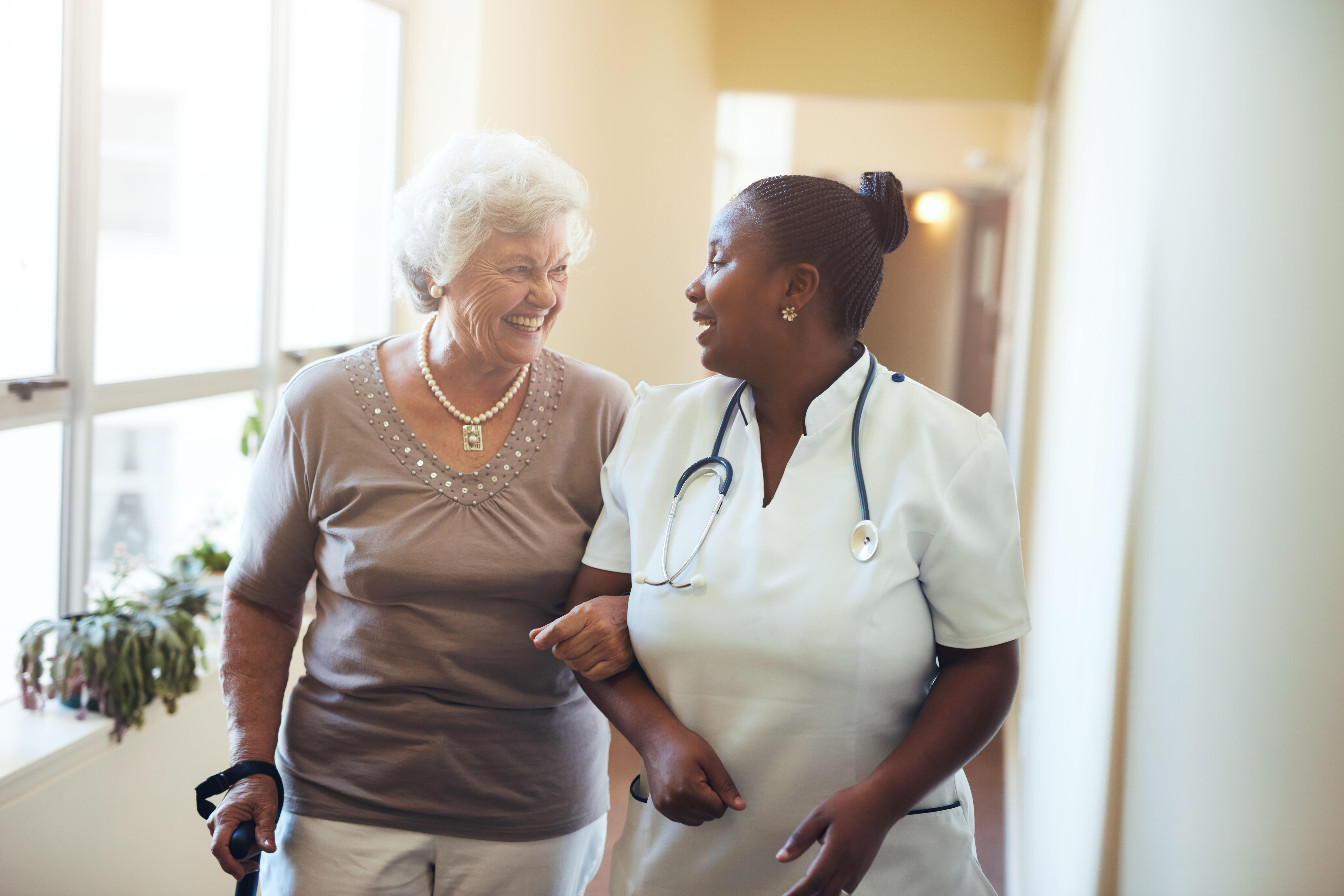 Nurse Assisting Senior Woman