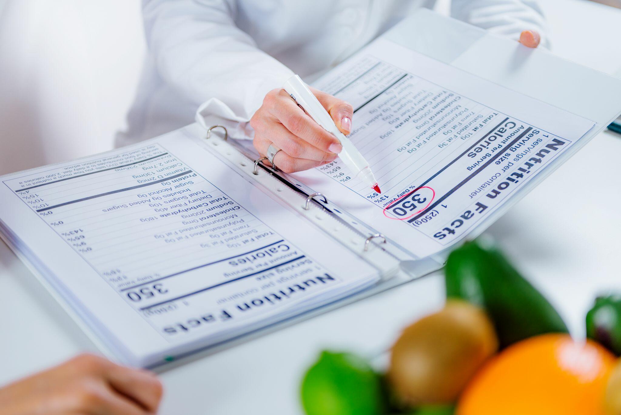 Nutritionist Helping a Female Patient