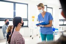 Portrait of Female Doctor working in Hospital Office