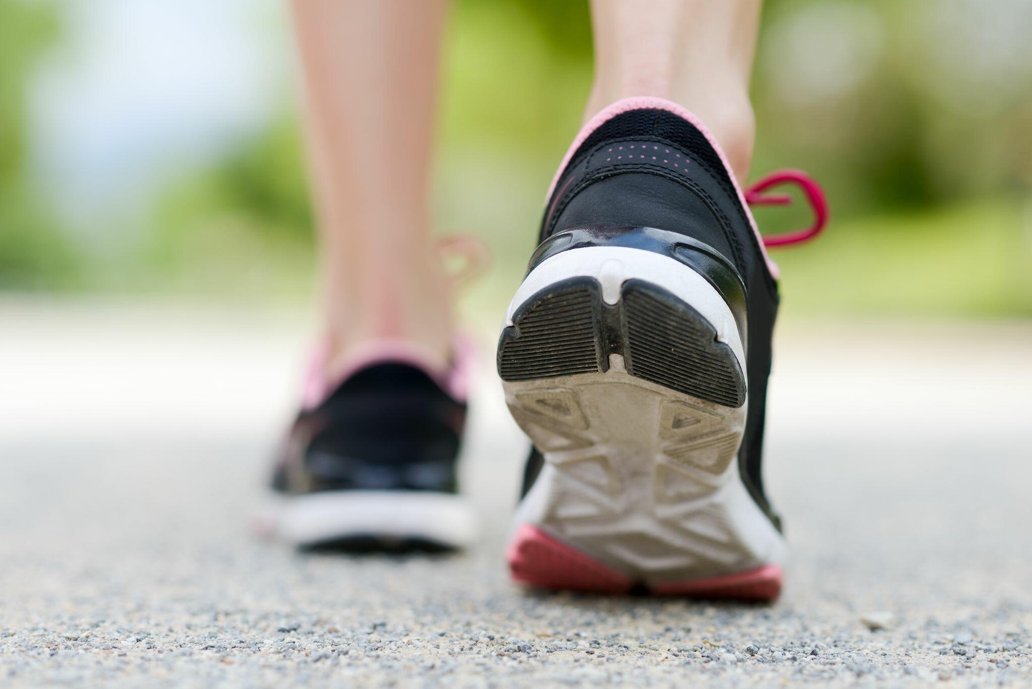 Runner's Feet Running on Road Closeup