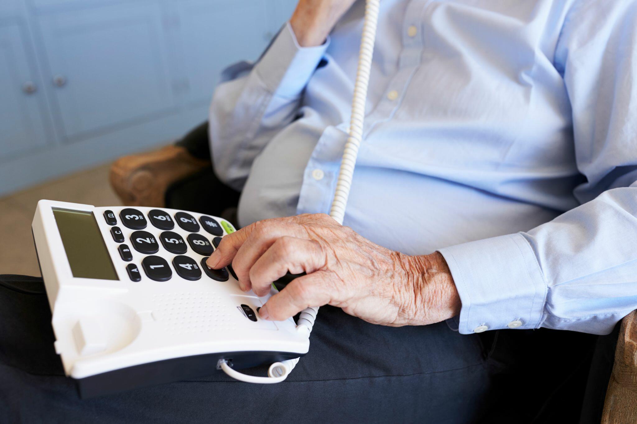 Senior Man at Home Using Telephone 2