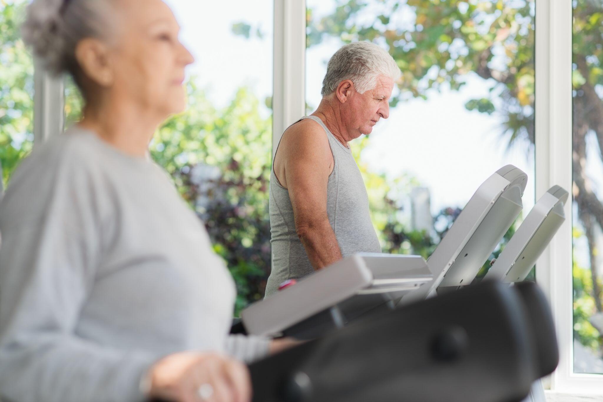 Senior Man & Women Exercising in Wellness Club