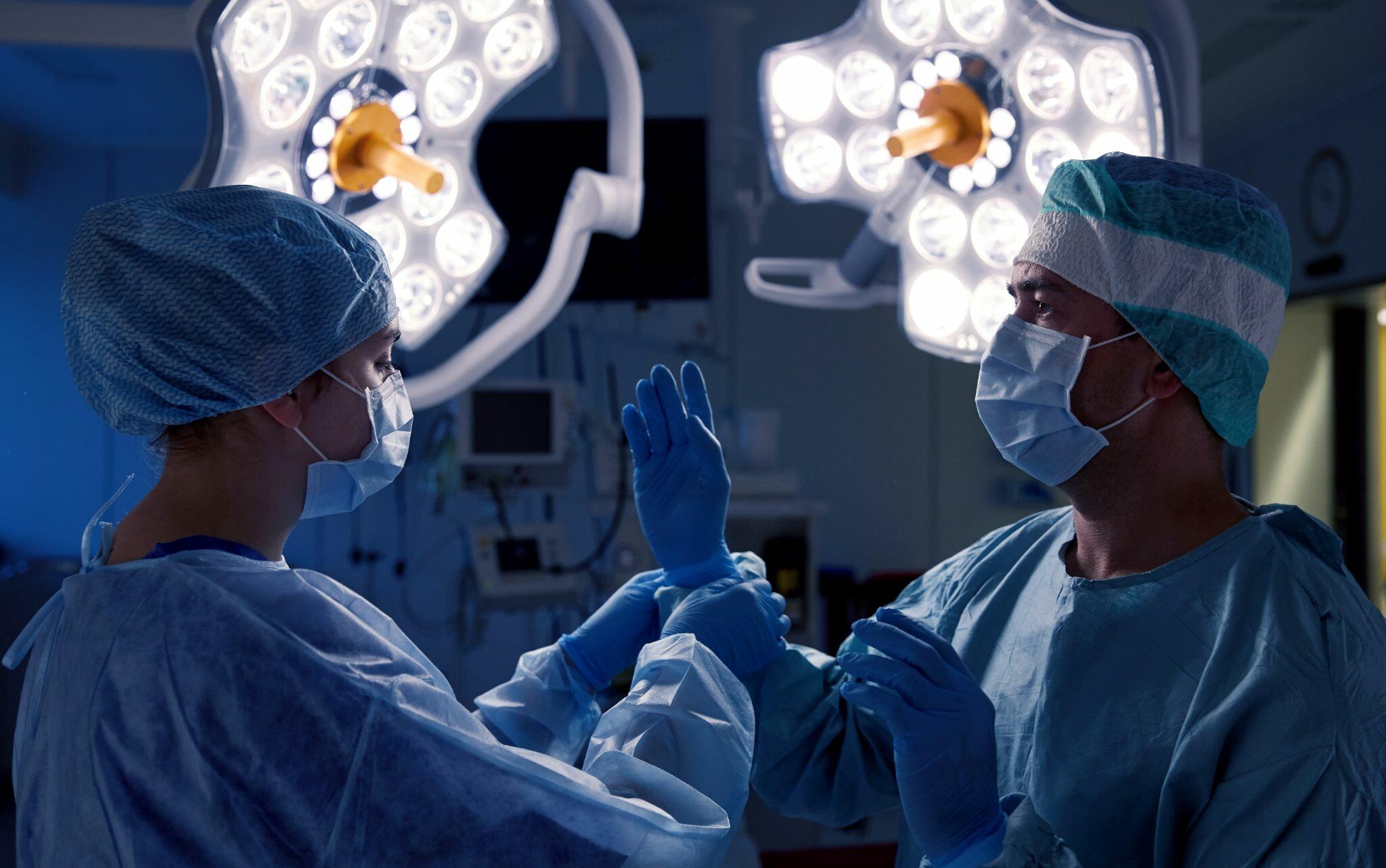Surgeons Operating in the Operating Room at Hospital