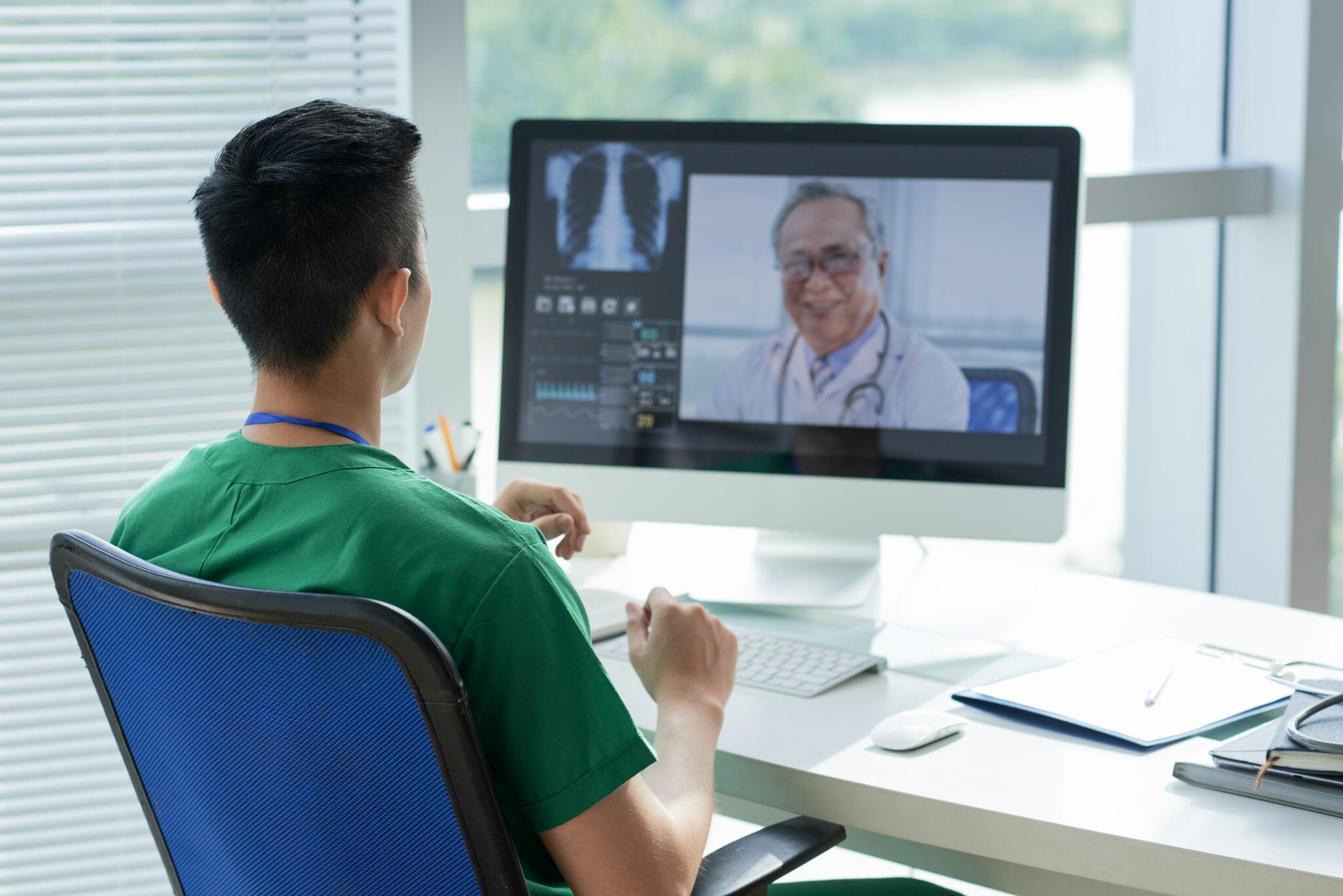 Nurse in Video Conference with Doctor
