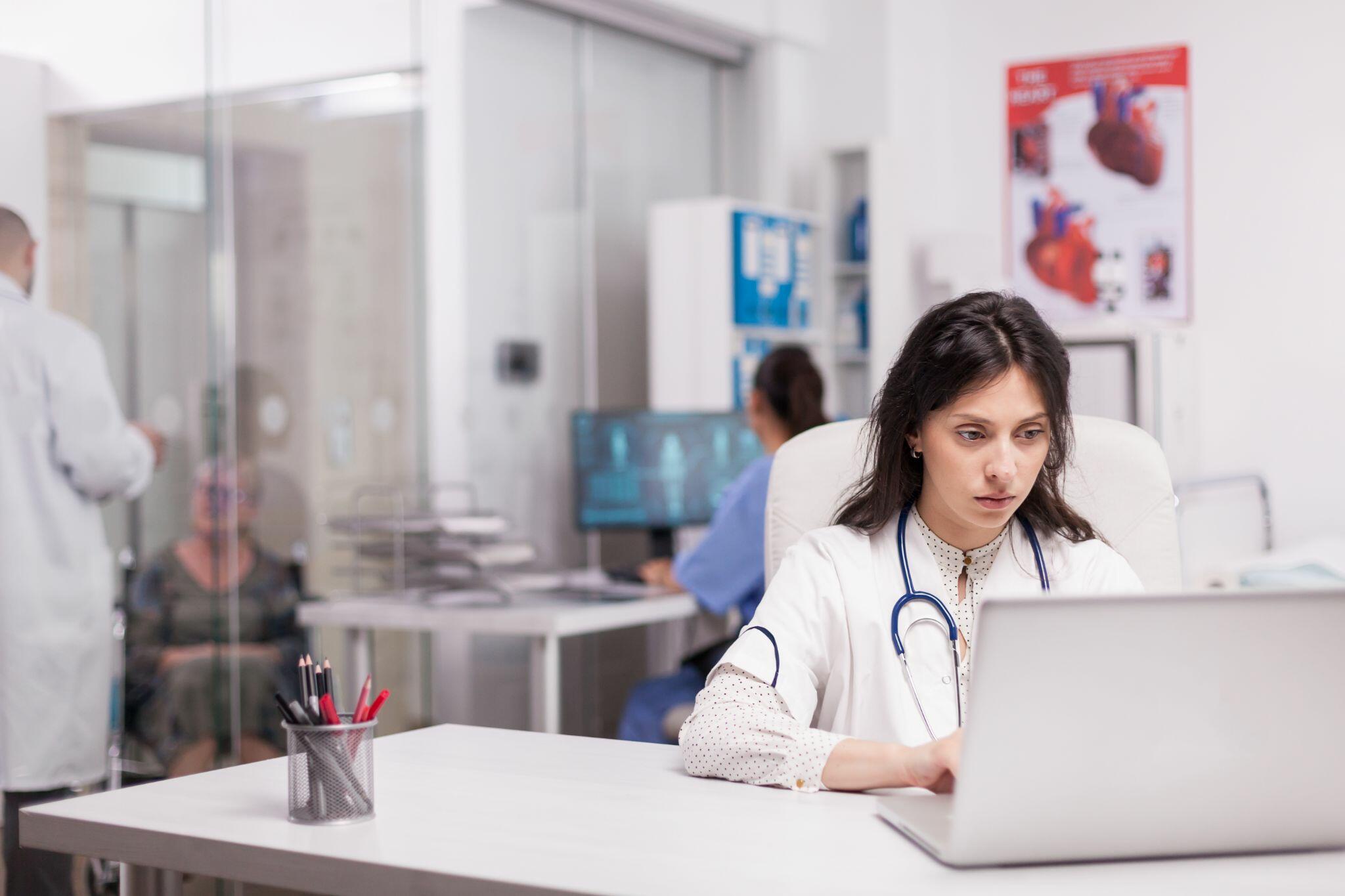 Young Doctor working in Hospital Office