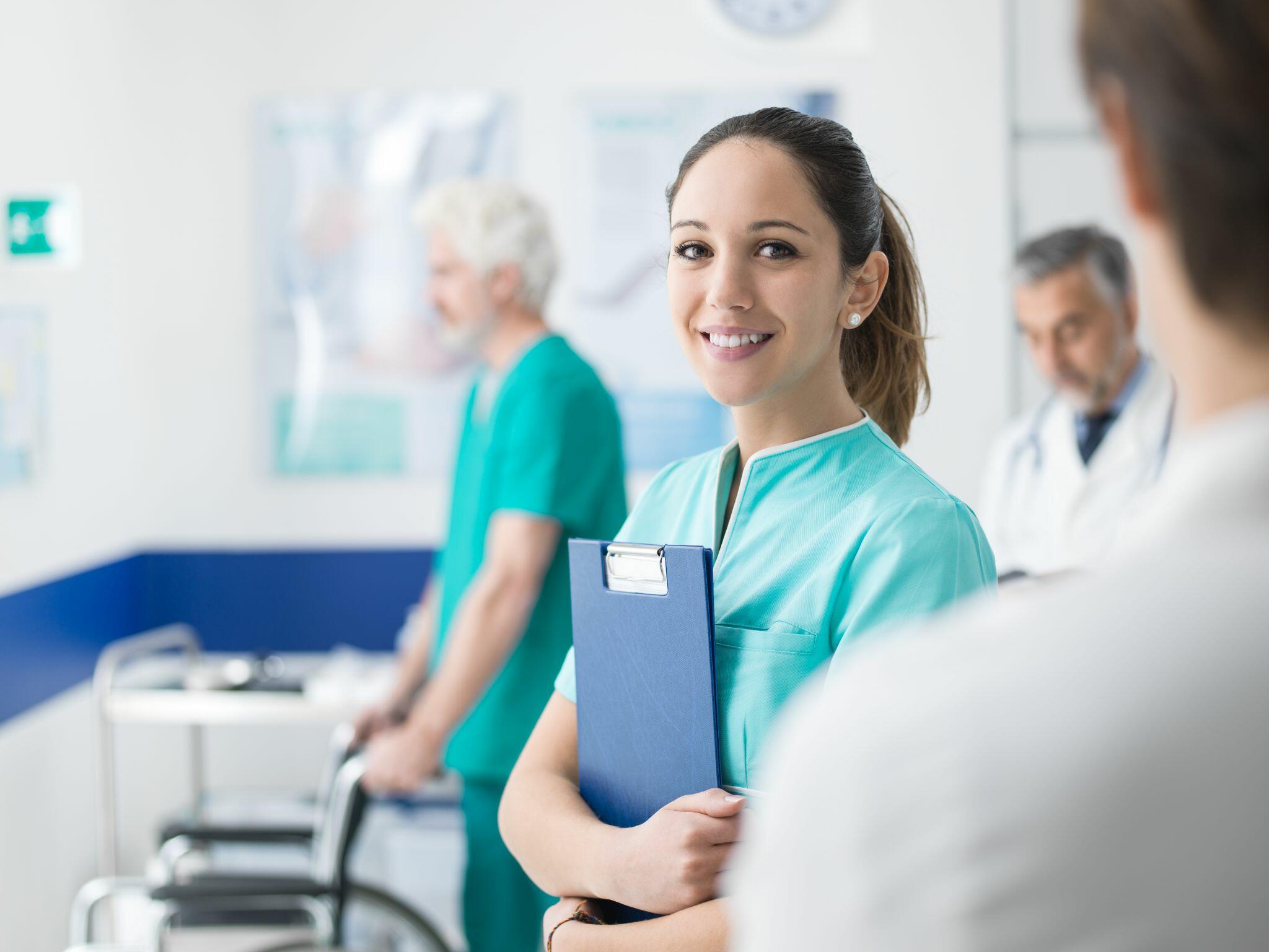 Young Smiling Nurse Working at Hospital